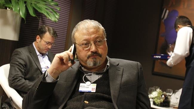 In this file picture, Saudi Arabian journalist Jamal Khashoggi speaks on his cellphone at the World Economic Forum in Davos, Switzerland. (Photo by AP)