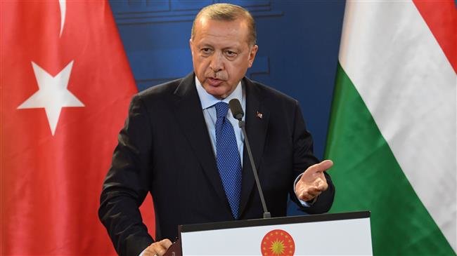 Turkish President Recep Tayyip Erdogan gestures during a joint press conference with the Hungarian Prime Minister (not pictured) following official talks in the parliament building of Budapest, on October 8, 2018. (Photo by AFP)