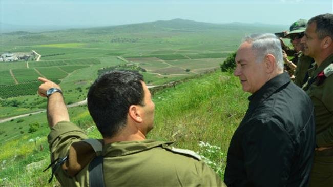 Israeli Prime Minister Benjamin Netanyahu (second from left) is seen during a tour of the occupied side of Syria’s Golan Heights.