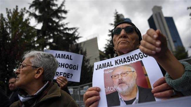 Protesters holds a portrait of missing journalist and Riyadh critic Jamal Khashoggi reading "Jamal Khashoggi is missing since October 2" during a demonstration in front of the Saudi Arabian consulate on October 9, 2018 in Istanbul.