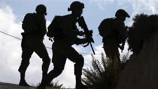 Israeli soldiers take position following clashes between Israeli settlers from the settlement of Yitzhar and Palestinians from the nearby Urif village, south of Nablus, in the occupied West Bank, October 10, 2018. (Photo by AFP)