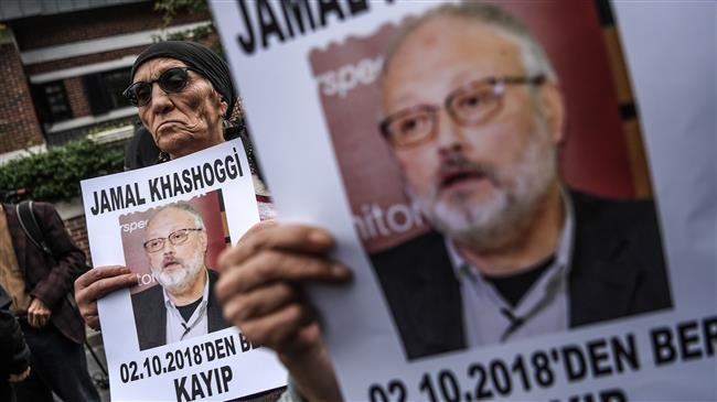 Protesters holds a portrait of missing journalist and Riyadh critic Jamal Khashoggi reading "Jamal Khashoggi is missing since October 2" during a demonstration in front of the Saudi Arabian consulate on October 9, 2018 in Istanbul. (Photo by AFP)