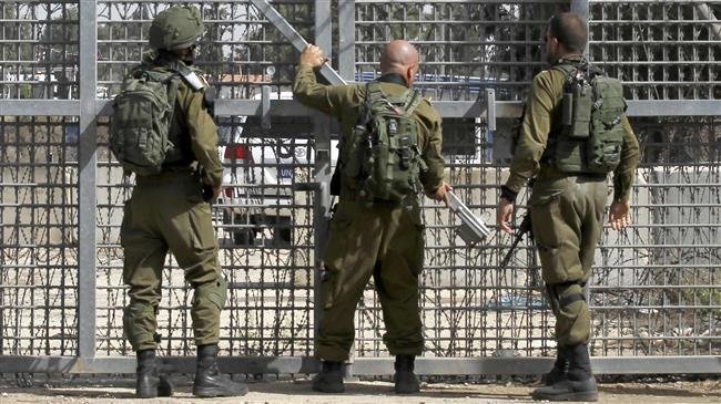 This file photo shows armed Israeli forces at a crossing point in occupied territories on October 15, 2018. (by AFP)