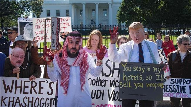 Demonstrators dressed as Saudi Arabian Crown Prince Mohammed bin Salman and US President Donald Trump (C) protest outside the White House in Washington, DC, on October 19, 2018, demanding justice for the then-missing Saudi journalist Jamal Khashoggi. (Photo by AFP)