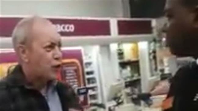 This blur video grab published in UK media on October 22, 2018, shows a white shopper allegedly hurling abuses at a black security guard in a supermarket in London.