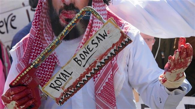 A demonstrator dressed as Saudi Arabian Crown Prince Mohammed bin Salman holds the royal bone saw outside the White House in Washington, DC, on October 19, 2018, as protesters demand justice for missing Saudi journalist Jamal Khashoggi. (AFP photo)