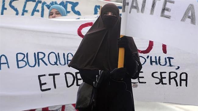 The file photo shows a woman in the French city of Tours wearing a niqab during protests over efforts to ban Islamic face coverings.