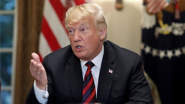 US President Donald Trump answers questions during a meeting with military leaders in the Cabinet Room on October 23, 2018 in Washington, DC. (Photo by AFP)
