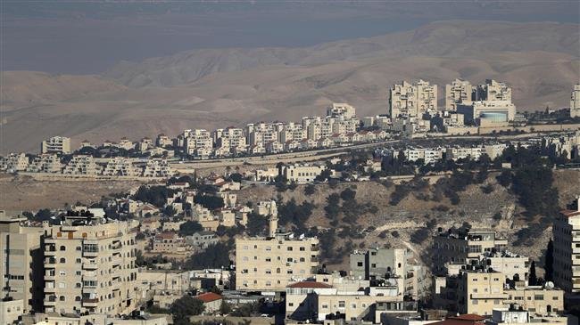 A general view shows Israel’s controversial separation barrier between the occupied West Bank village of al-Zaayem and Israel’s largest Jewish settlement Maale Adumim (background), on September 27, 2018. (Photo by AFP)