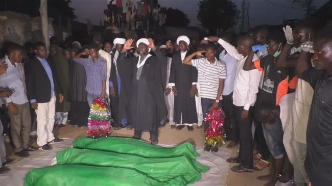The image shows the supporters of the Islamic Movement in Nigeria (IMN) praying next to the bodies that have been killed by Nigerian army during peaceful protests on October 29 and 30. (Photo by Reuters)