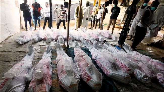 Members of the Islamic Movement in Nigeria prepare bodies of supporters who were killed after security forces opened fire during protests in the capital Abuja this week, before their burial in Mararaba, Nigeria, October 31, 2018. (Photo by Reuters)
