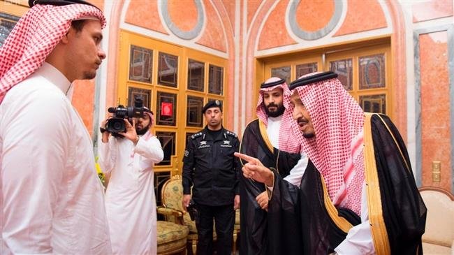 Saudi King Salman (R) speaks to Salah (L), son of Jamal Khashoggi, as Crown Prince Mohammed bin Salman looks on in Riyadh on October 23, 2018. (Photo by Saudi Press Agency)
