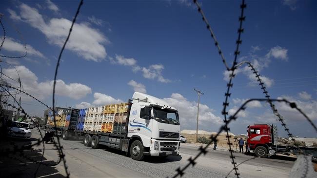 The file photo shows a truck carrying goods to Palestinians at Kerem Shalom crossing in Rafah in the southern Gaza Strip on August 15, 2018. (Photo by AFP)