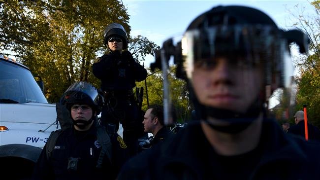 Riot police deploy as US President Donald Trump visits the Tree of Life Congregation on October 30, 2018 in Pittsburgh, Pennsylvania. (Photo by AFP)