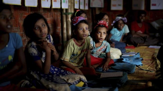 Rohingya refugee children attend a UNICEF-run school in the Balukhali refugee camp, in Bangladesh, on August 27, 2018. (Photo by AP)