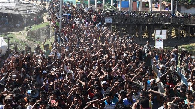 Rohingya refugees shout slogans at a protest against a disputed repatriation program at the Unchiprang refugee camp, near Teknaf, in Bangladesh, on November 15, 2018. (Photo by AFP)