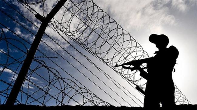 File photo shows the silhouette of an Iranian guard stationed in the country’s southwestern province of Sistan and Baluchestan.
