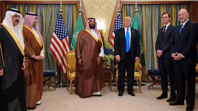 In this file photo, taken on May 20, 2017, US President Donald Trump (C-R) and the then-Saudi Deputy Crown Prince Mohammad bin Salman take part in a bilateral meeting at a hotel in Riyadh. Trump’s son-in-law, Jared Kushner, is seen standing to the right of the US president. (By AFP)