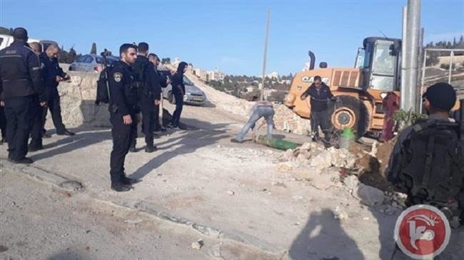 An Israeli bulldozer can be seen destroying a Palestinian property in the Silwan neighborhood, located on the outskirts of the occupied Old City of East Jerusalem al-Quds, on November 19, 2018. (Photo by Ma’an)
