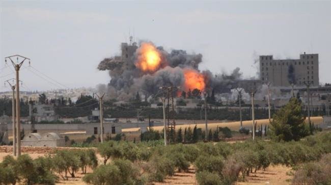 The undated photo shows balls of fire after an airstrike by the US-led coalition on the city of Manbij in Aleppo, northwestern Syria. (Photo by Reuters)