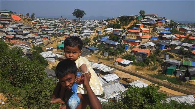 Young Rohingya refugees look on as a general view of Balukhali refugee camp is pictured in Ukhia, Bangladesh, on November 16, 2018. (Photo by AFP)