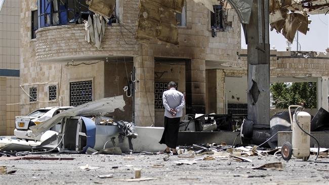 A Yemeni man walks through the rubble and debris of a destroyed petrol station that was hit by a Saudi-led airstrike in the capital Sana’a on May 27, 2018. (Photo by AFP)