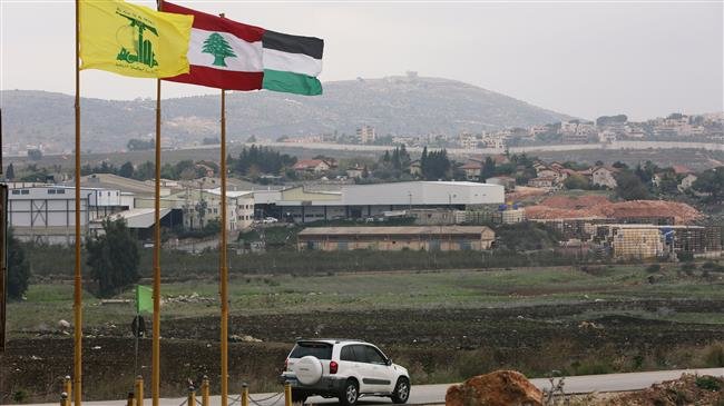 Flags of Hezbollah, Lebanon and Palestine are seen fluttering in the southern town of Khiam, Lebanon, December 4, 2018. (Photo by Reuters)