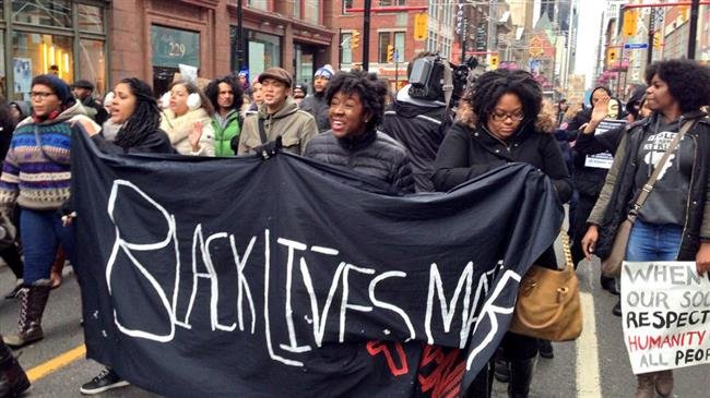 Demonstrators protest police brutality against black residents in a Black Lives Matter rally in Toronto, Canada. (File photo)