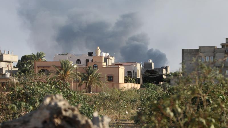 Smoke rises during heavy clashes between rival factions in Tripoli, Libya, August 28,