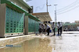 تنظیف گنبد و محیط پیرامونی حرم مطهر حضرت ابالفضل (ع) در آستانه محرم