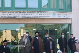 تقدیم شاخه گل و عطر افشانی مزار منور شهدا توسط کارمندان مرکز مدیریت در هفته بسیج