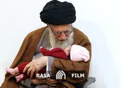اذان‌ و اقامه رهبری در گوش فرزند شهيد بلباسی