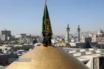 آیین تعویض پرچم گنبد منور رضوی در روز میلاد امام رضا(علیه&zwnj;السلام)