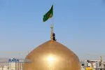 آیین تعویض پرچم گنبد منور رضوی در روز میلاد امام رضا(علیه&zwnj;السلام)