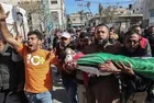 Thousands bury Palestinian killed in clashes with Israeli troops